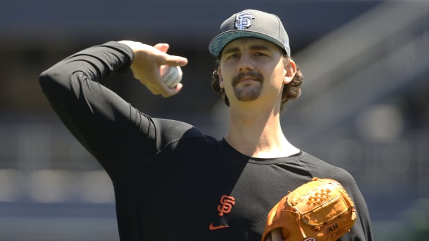 SF Giants pitcher Sean Hjelle warms up before a game.